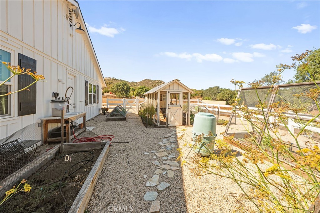 41260 De Anna Ranch Road Murrieta, CA 92562 - Photo 49 of 57 a view of a terrace with wooden floor and a yard