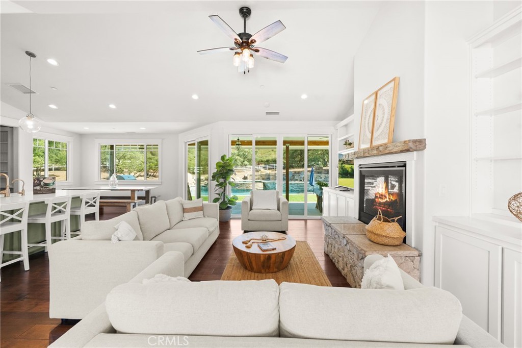 41260 De Anna Ranch Road Murrieta, CA 92562 - Photo 6 of 57 a living room with furniture a fireplace and a chandelier