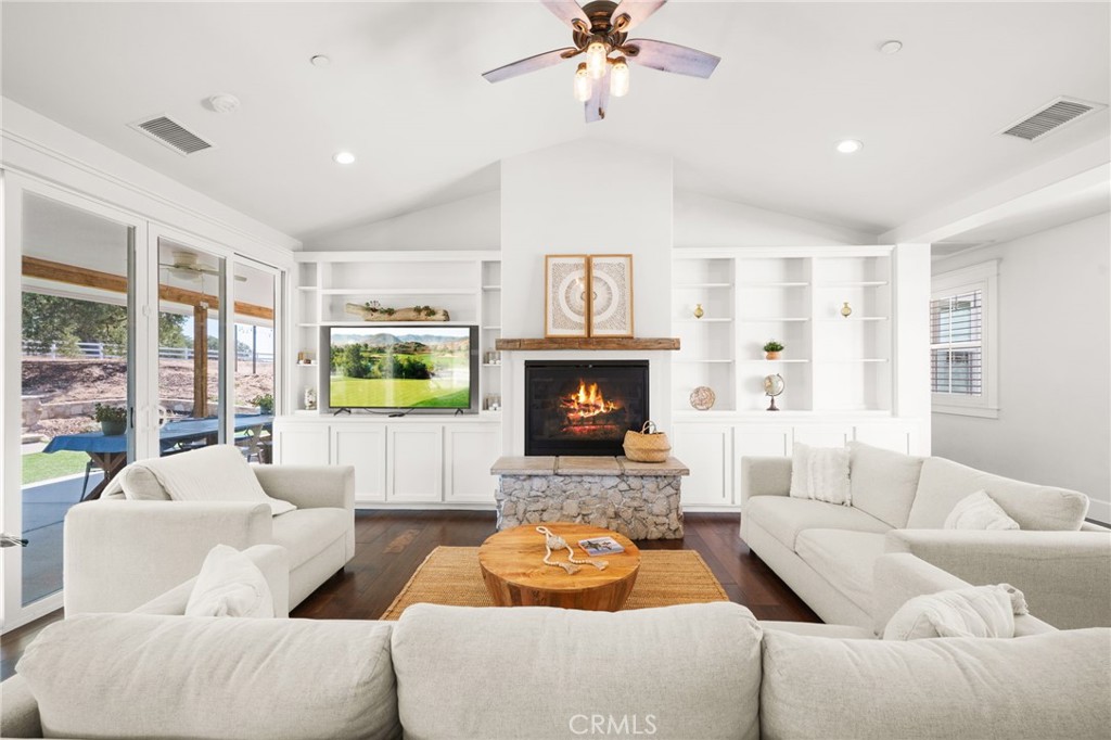41260 De Anna Ranch Road Murrieta, CA 92562 - Photo 7 of 57 a living room with furniture and a fireplace