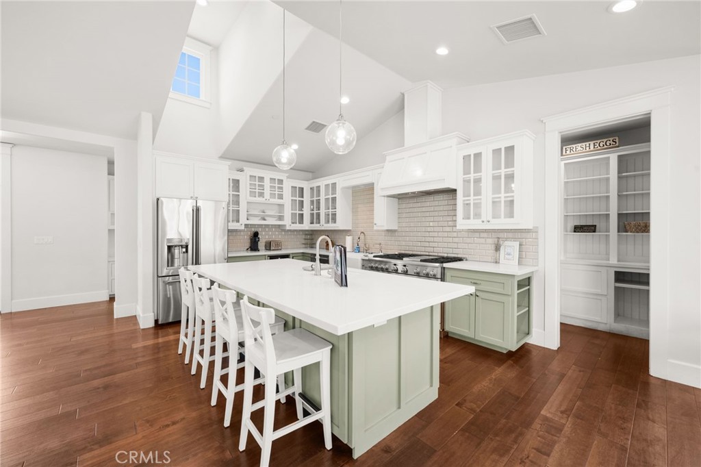 41260 De Anna Ranch Road Murrieta, CA 92562 - Photo 9 of 57 a large kitchen with a table and chairs