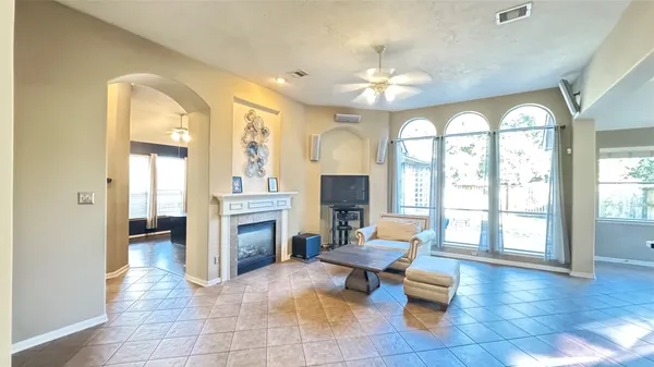 a living room with furniture and a large window