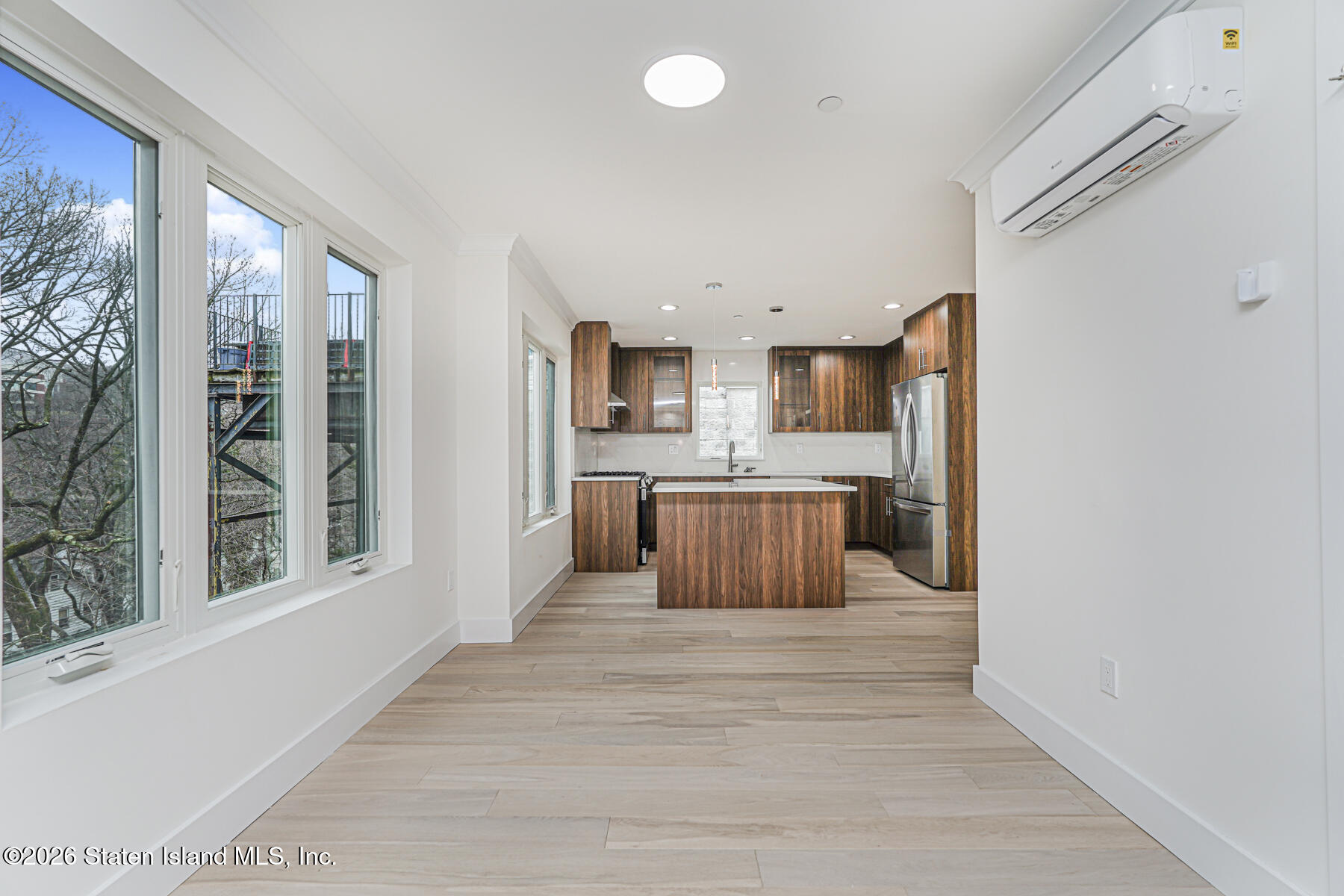 54 Cedarcliff Road Staten Island, NY 10301 - Photo 15 of 49 a large kitchen with kitchen island a large window appliances and cabinets