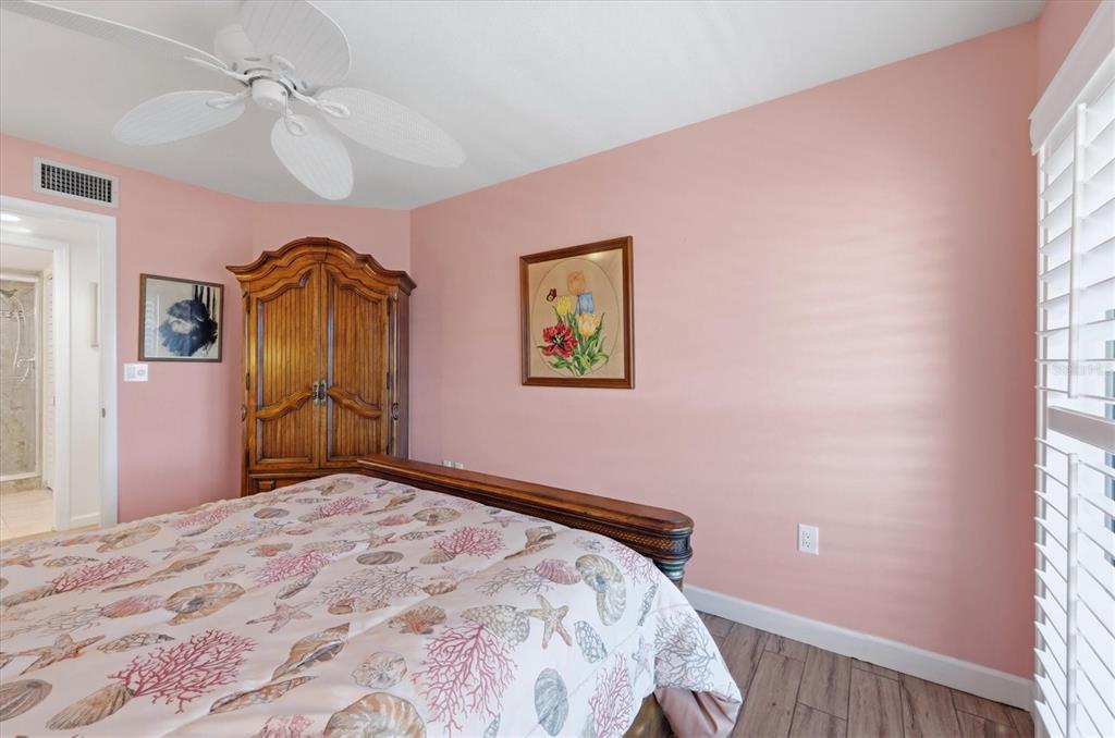 2729 North Beach Road, Unit 211 Englewood, FL 34223 - Photo 32 of 51 a bedroom with a bed and a window
