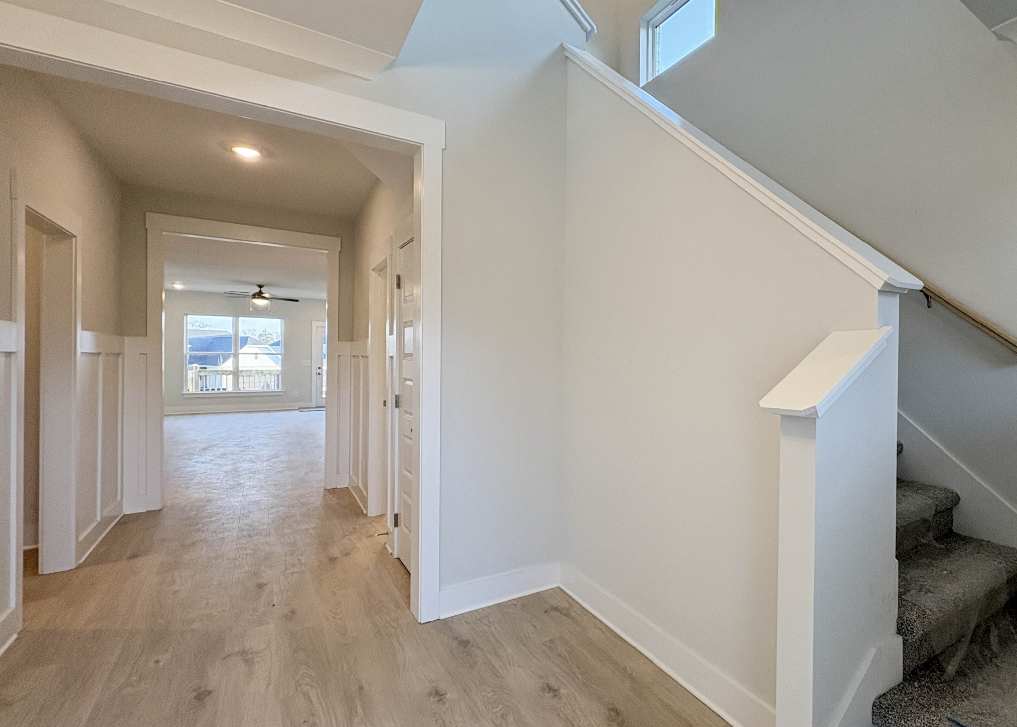 314 Booker Drive Gallatin, TN 37066 - Photo 8 of 30 a view of a hallway with wooden floor and staircase