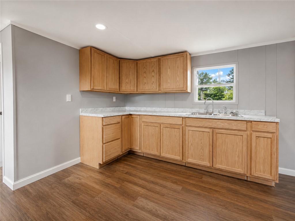 3301 Dixon Road Anderson, SC 29625 - Photo 10 of 20 Well-lit kitchen offers generous counter space and ample cabinetry, ready for culinary endeavors.