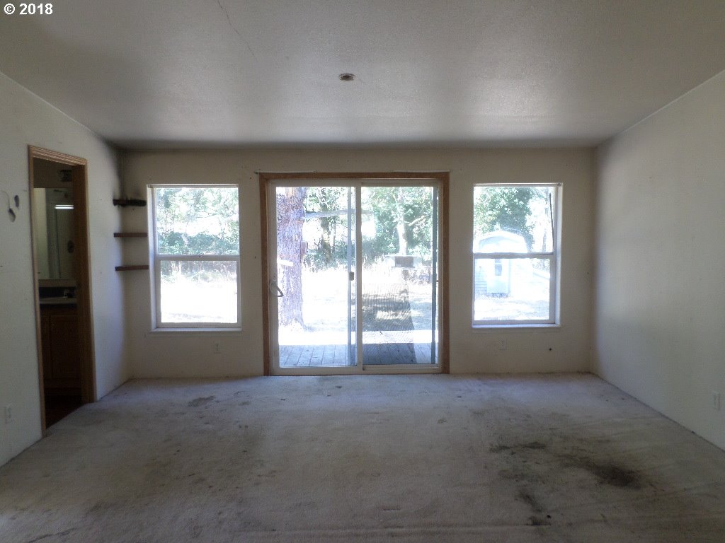 15063 South Hattan Road Oregon City, OR 97045 - Photo 14 of 25 a view of an empty room with a window
