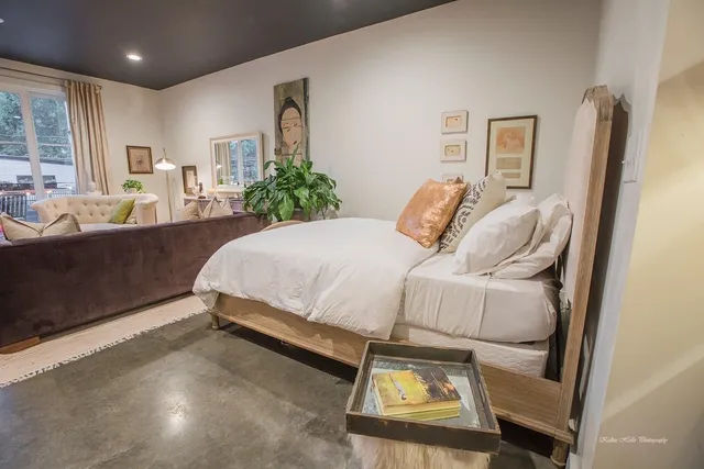 a bedroom with bed and window