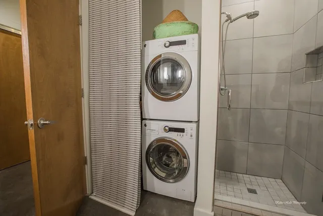 a view of a hallway with washer and dryer