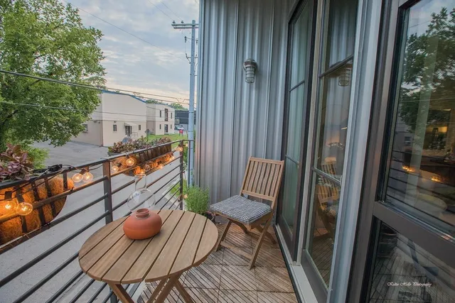 a view of balcony with wooden floor