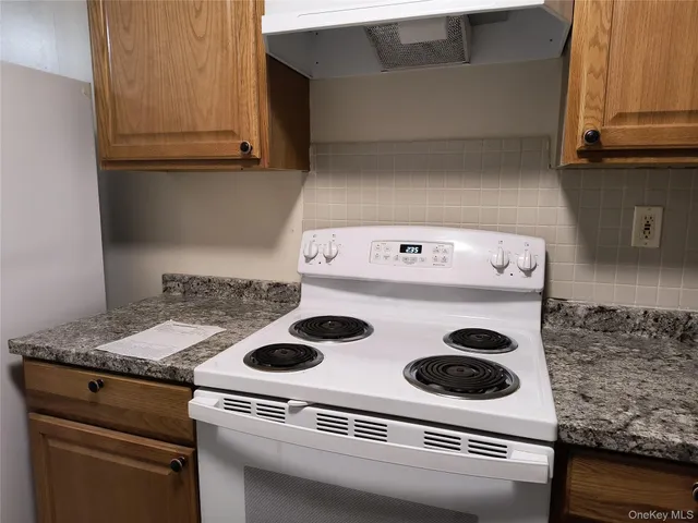 a close view of stove top oven sitting inside of a kitchen
