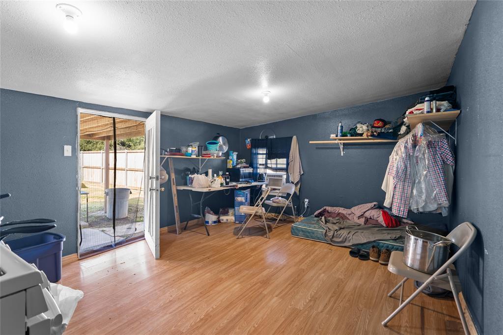 4115 Peachtree Road Balch Springs, TX 75180 - Photo 17 of 24 a living room with furniture and a wooden floor