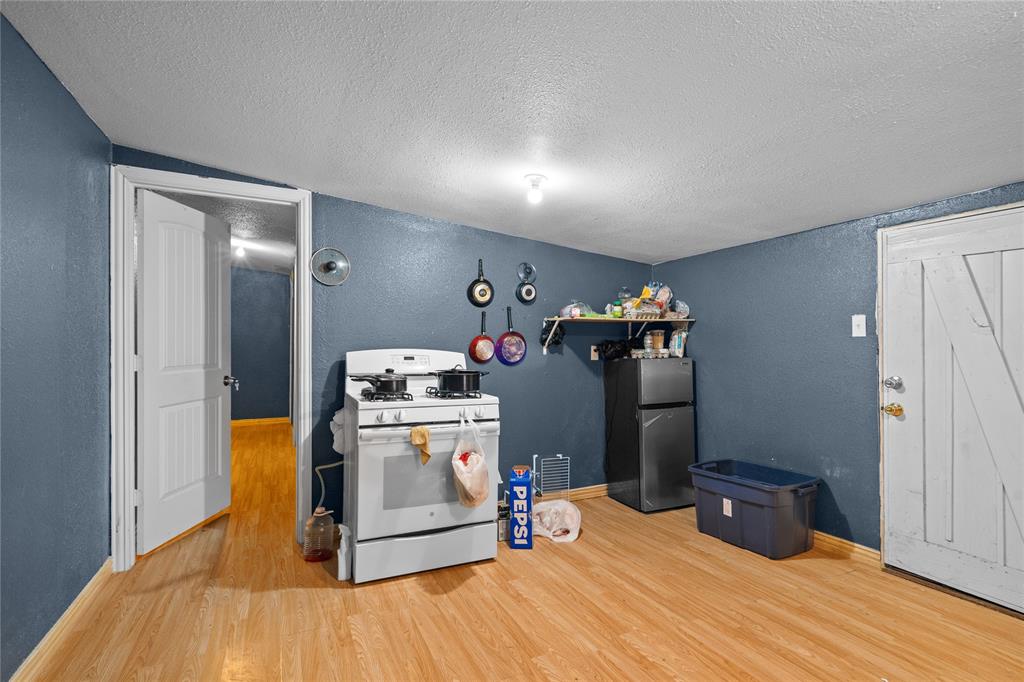 4115 Peachtree Road Balch Springs, TX 75180 - Photo 18 of 24 a room filled with furniture and storage