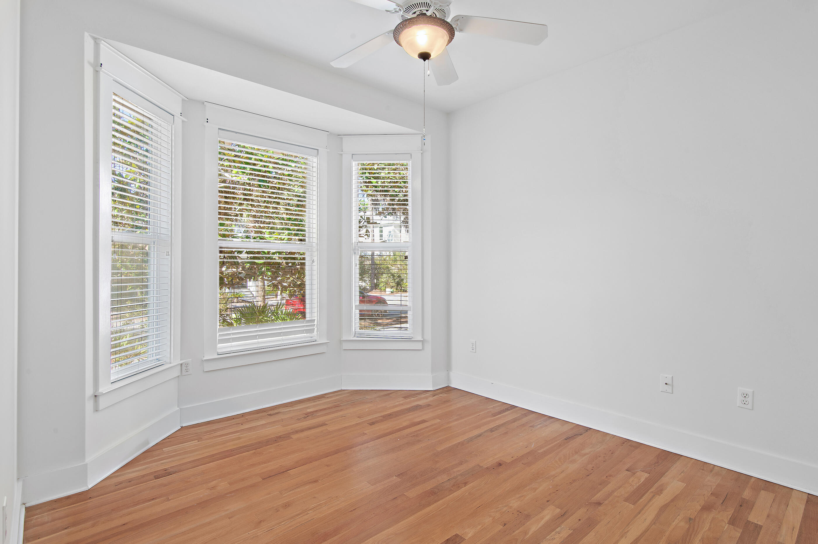 158 Cullman Avenue Santa Rosa Beach, FL 32459 - Photo 11 of 47 an empty room with wooden floor and windows