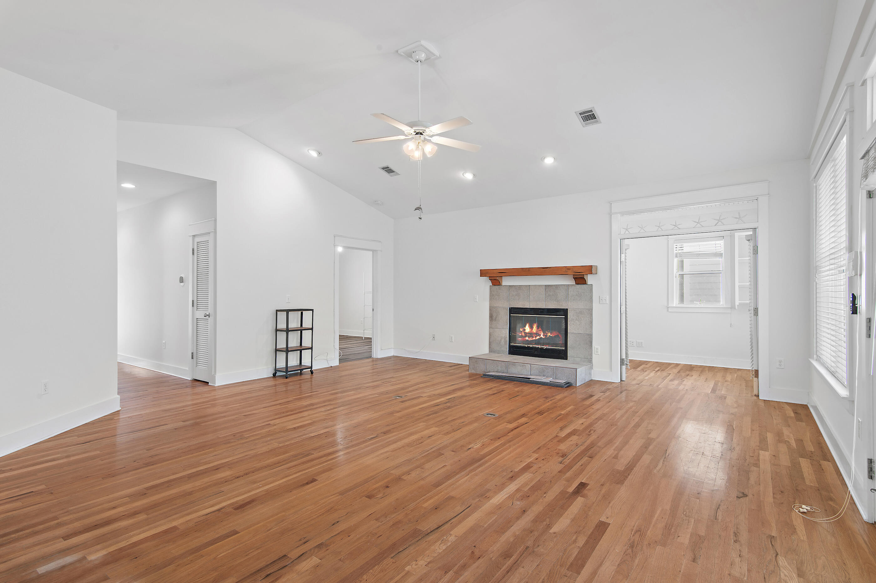 158 Cullman Avenue Santa Rosa Beach, FL 32459 - Photo 13 of 47 a view of an empty room with a fireplace and a window