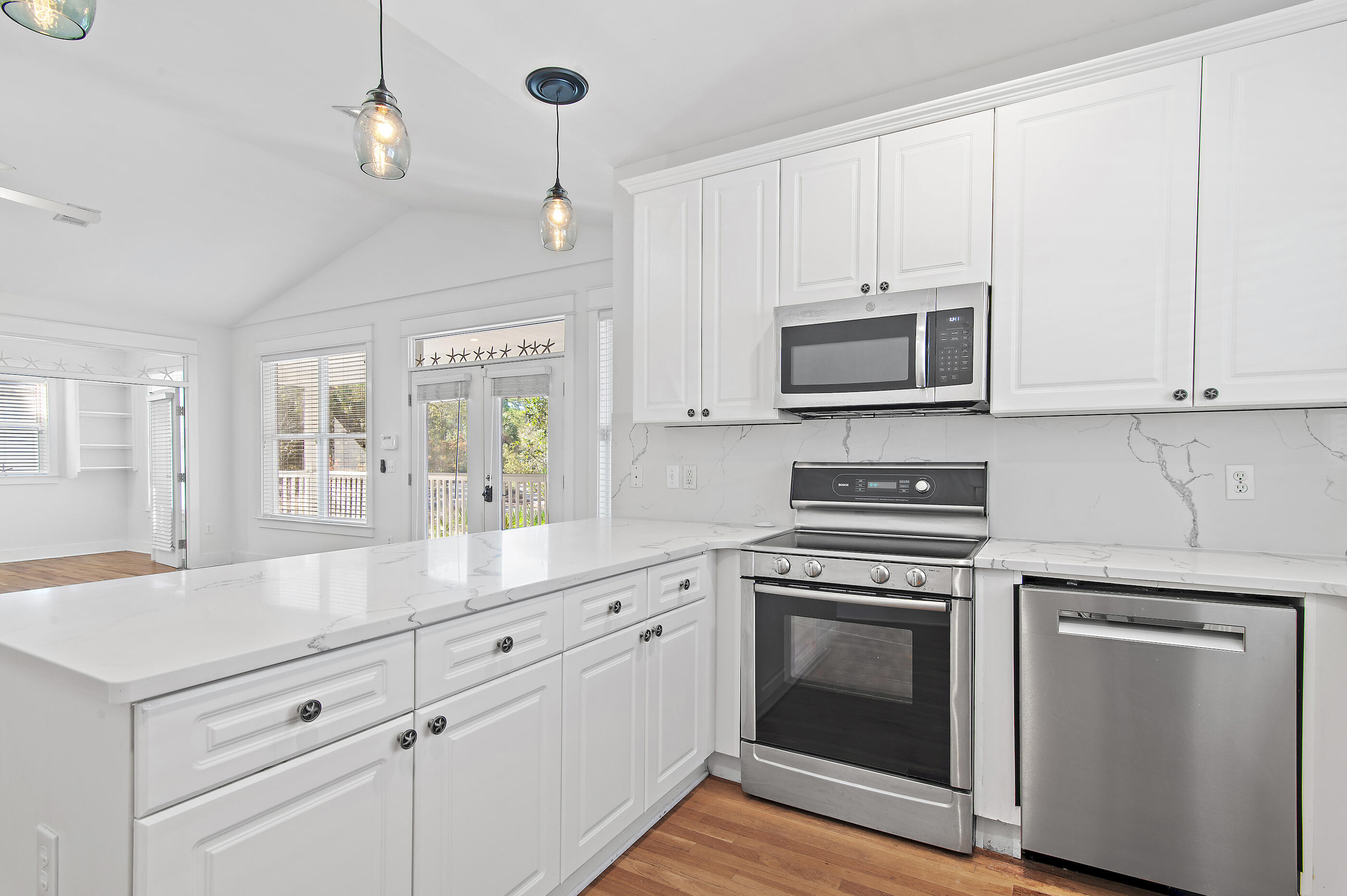 158 Cullman Avenue Santa Rosa Beach, FL 32459 - Photo 17 of 47 a kitchen with cabinets stainless steel appliances and wooden floor