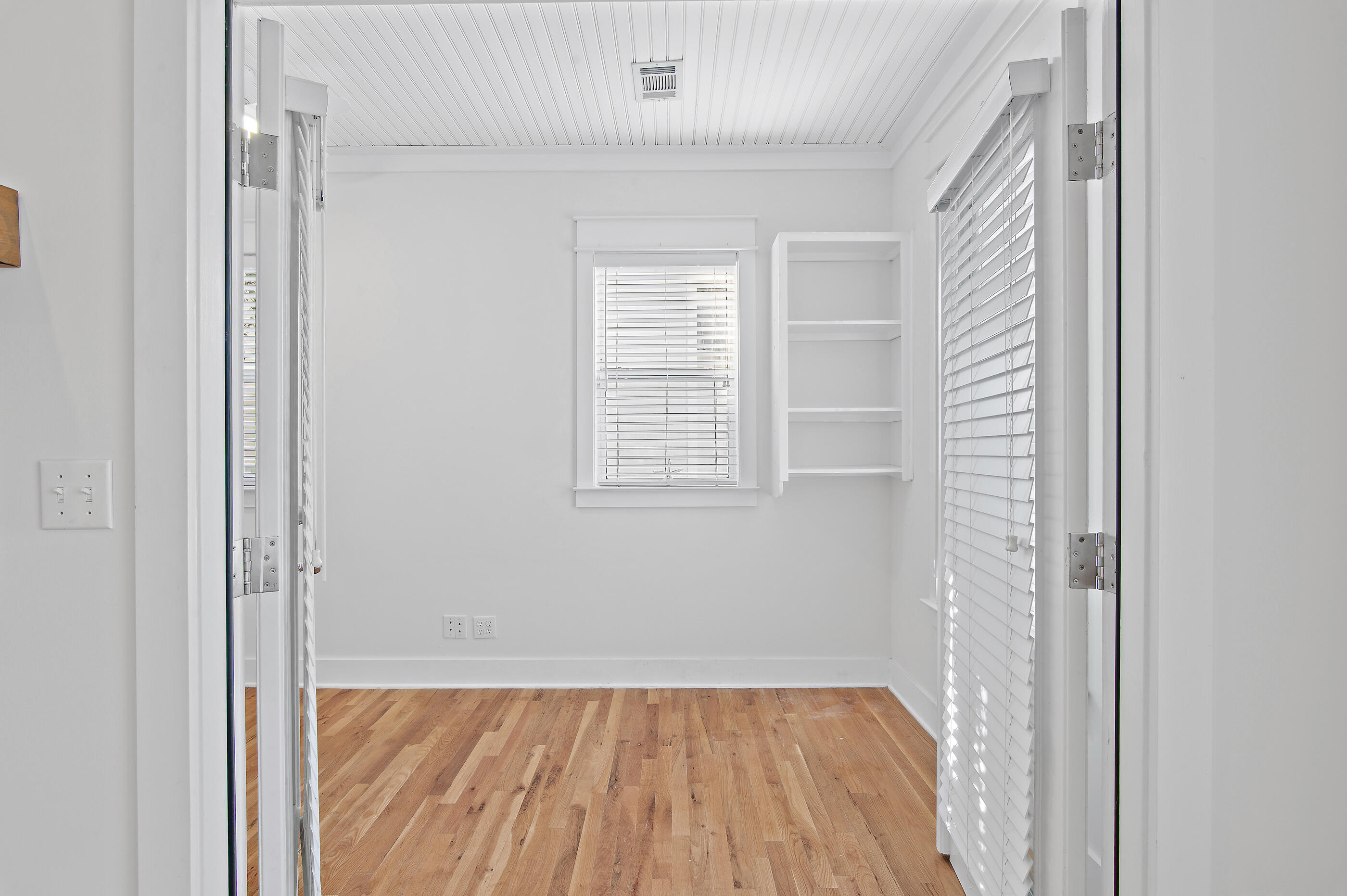 158 Cullman Avenue Santa Rosa Beach, FL 32459 - Photo 18 of 47 a view of a small space with wooden floor and a window