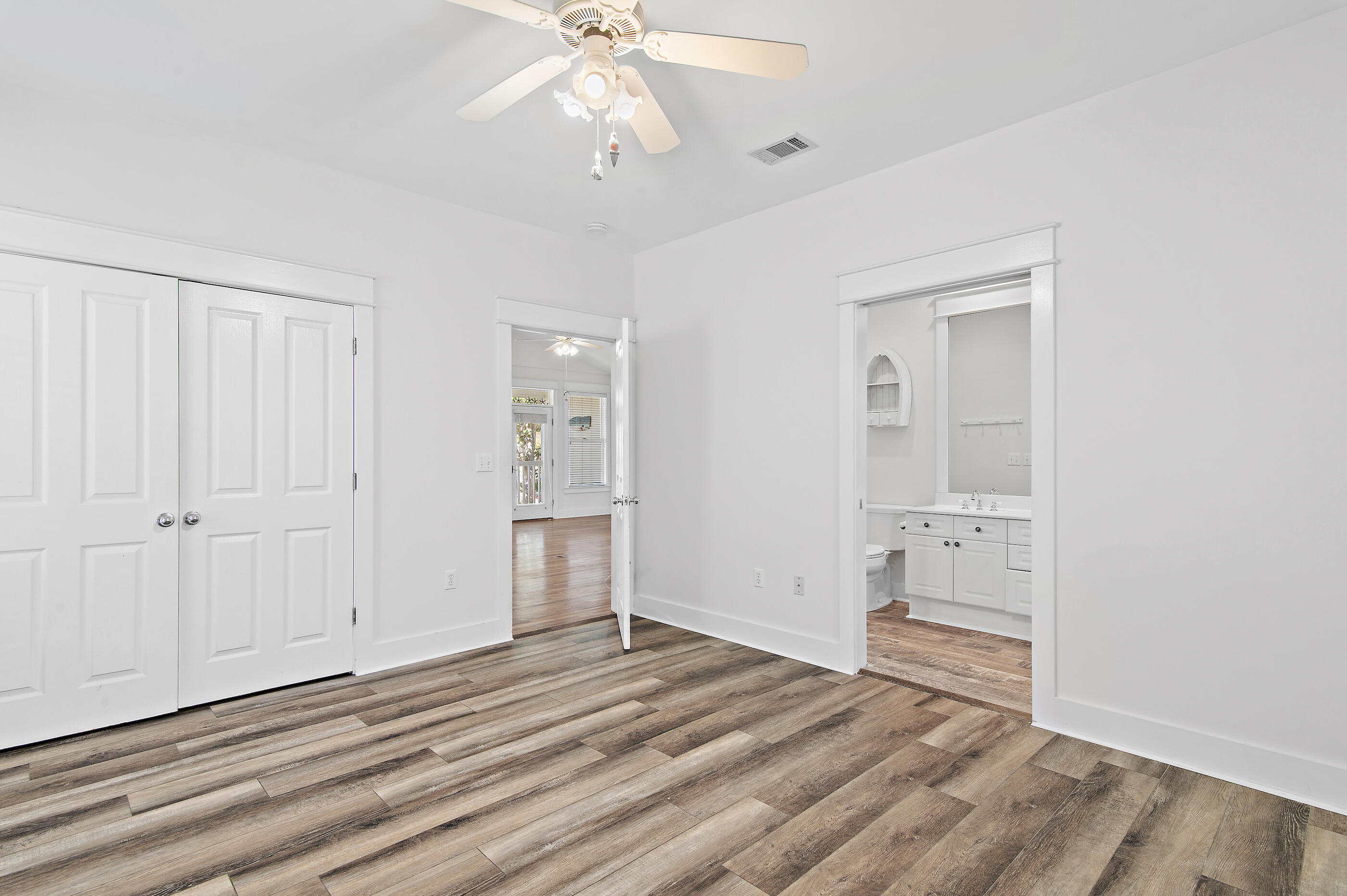 158 Cullman Avenue Santa Rosa Beach, FL 32459 - Photo 19 of 47 a view of empty room with wooden floor