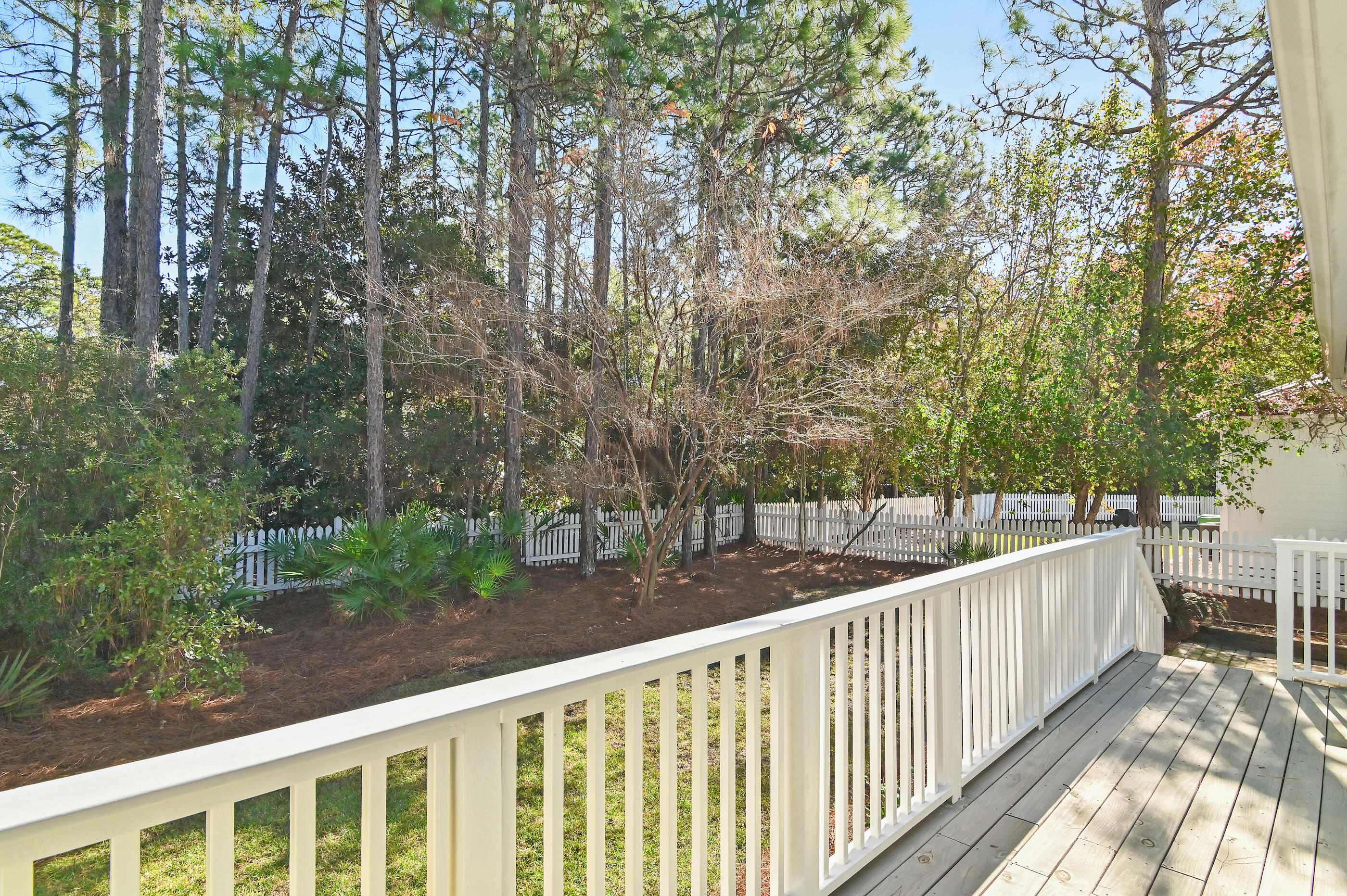 158 Cullman Avenue Santa Rosa Beach, FL 32459 - Photo 27 of 47 a view of a wooden deck next to a yard