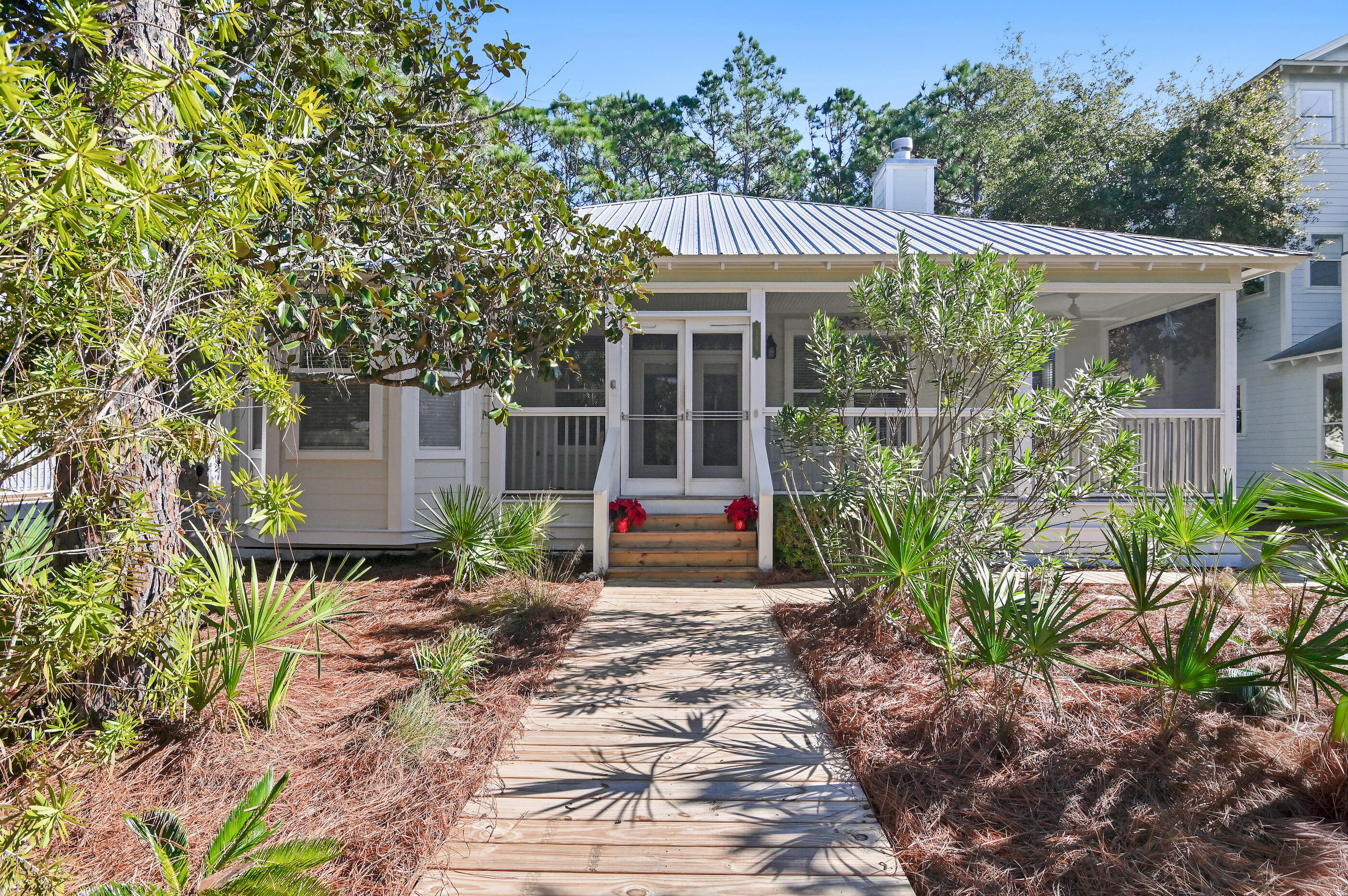 158 Cullman Avenue Santa Rosa Beach, FL 32459 - Photo 3 of 47 a front view of a house with garden