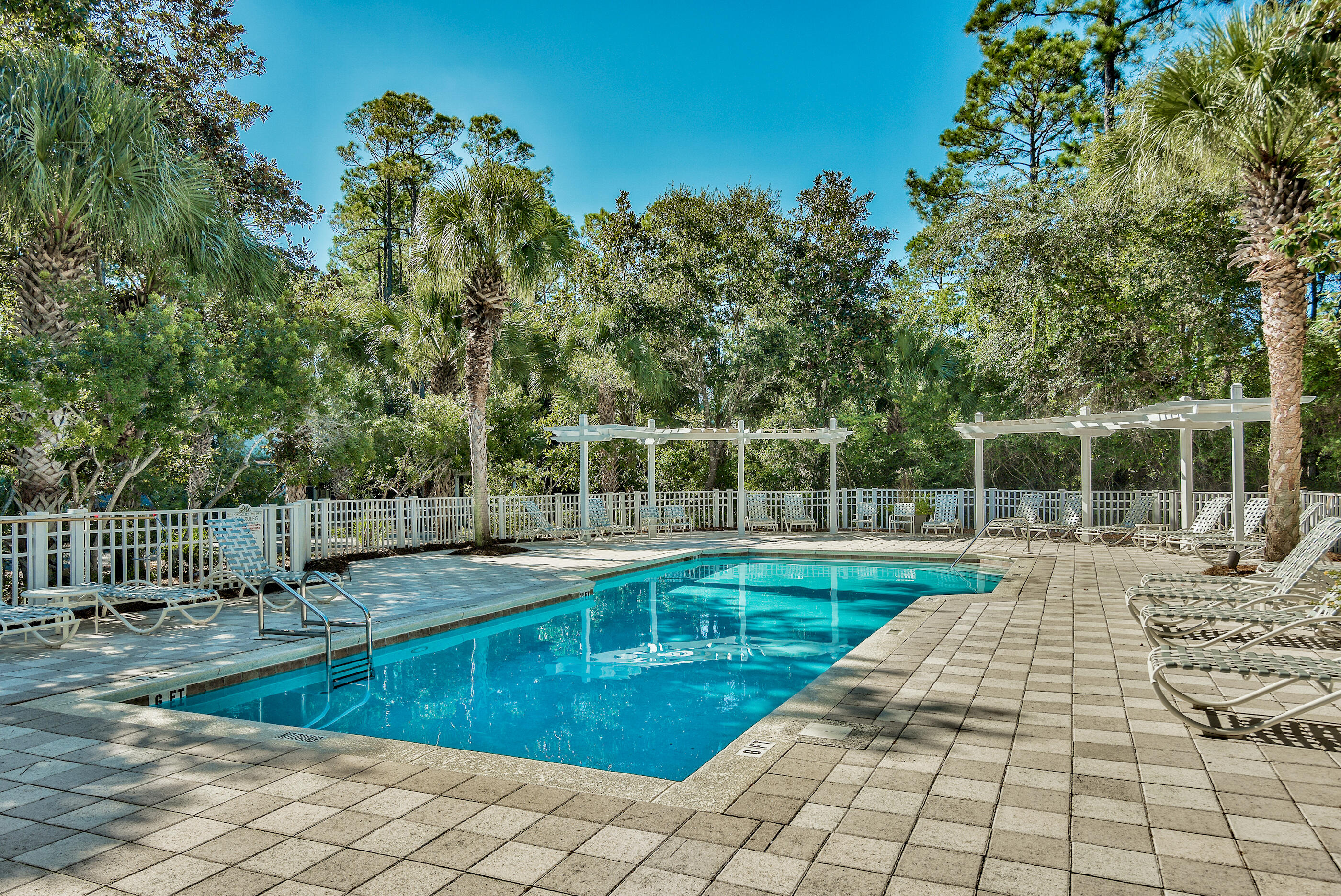 158 Cullman Avenue Santa Rosa Beach, FL 32459 - Photo 36 of 47 a view of a swimming pool with a lounge chair