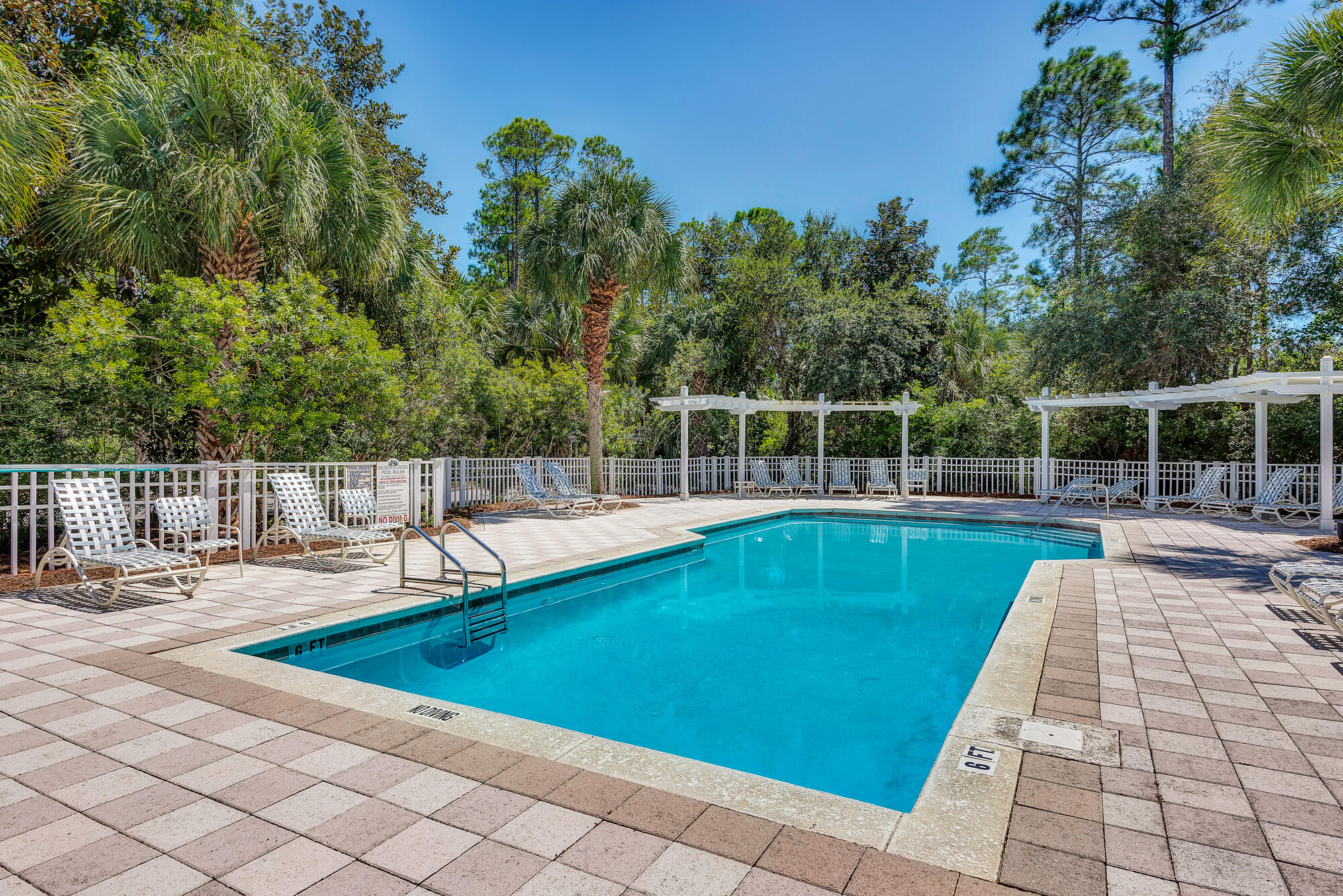 158 Cullman Avenue Santa Rosa Beach, FL 32459 - Photo 37 of 47 a view of a swimming pool with a lounge chair