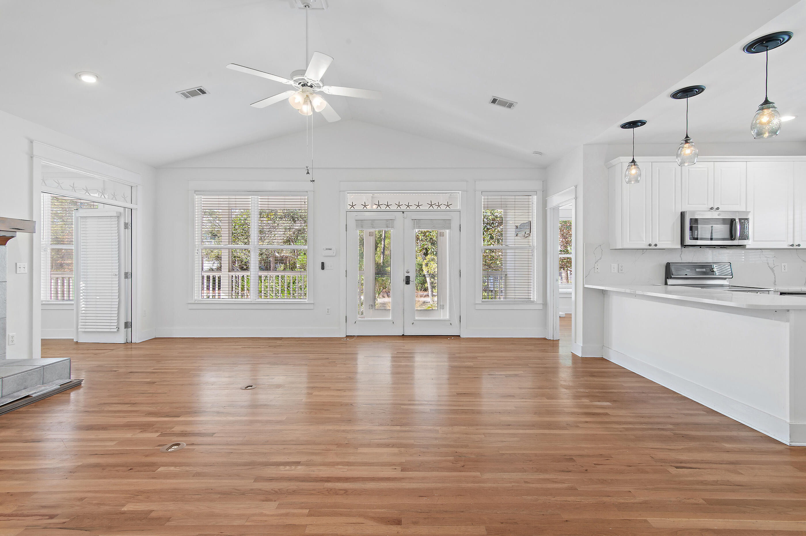 158 Cullman Avenue Santa Rosa Beach, FL 32459 - Photo 9 of 47 a view of an empty room with window and wooden floor