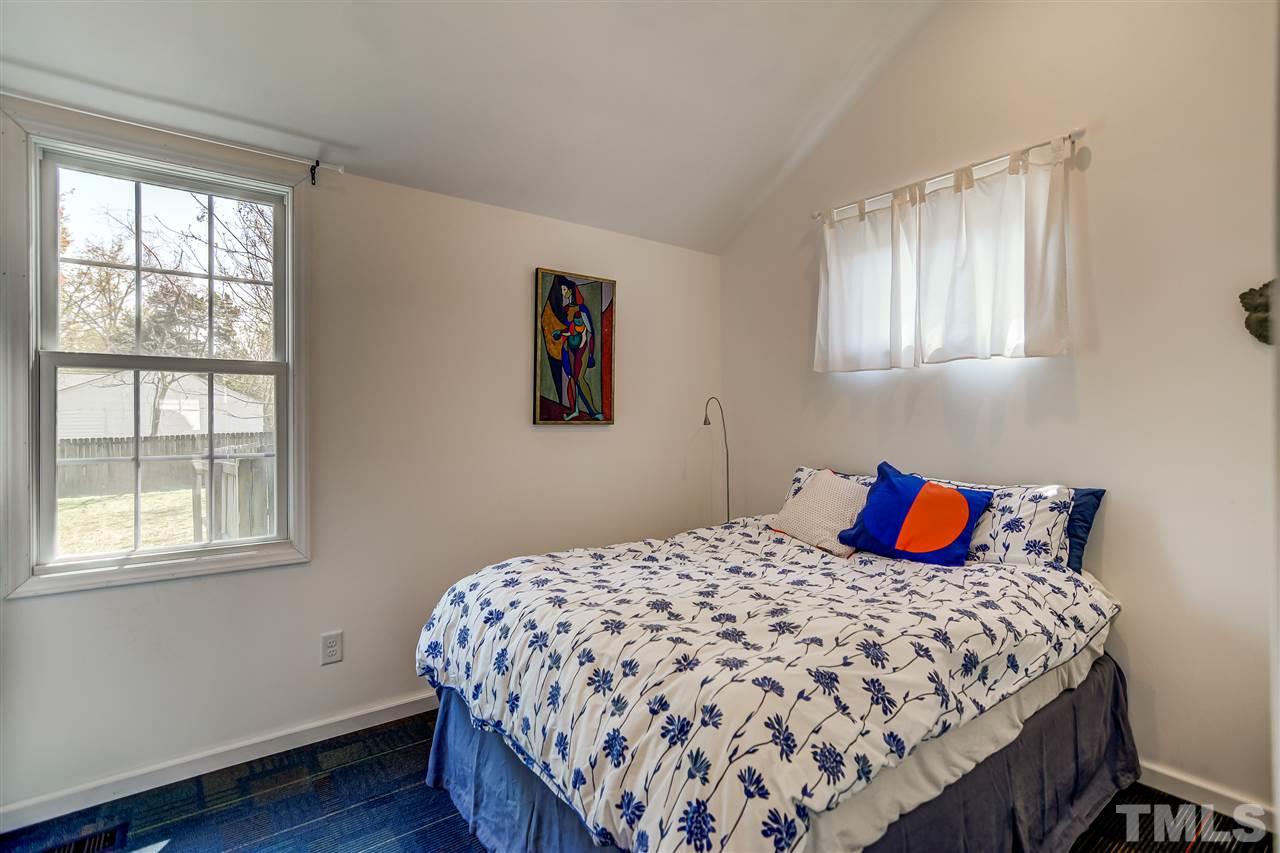 2112 Pelham Road Raleigh, NC 27610 - Photo 14 of 22 a bedroom with a bed and wooden floor