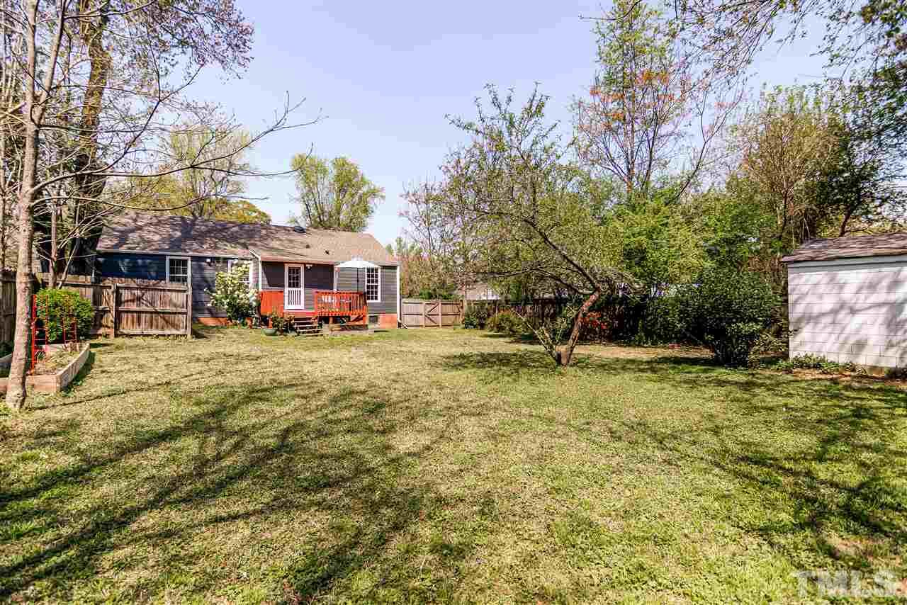 2112 Pelham Road Raleigh, NC 27610 - Photo 22 of 22 a front view of a house with a yard table and chairs