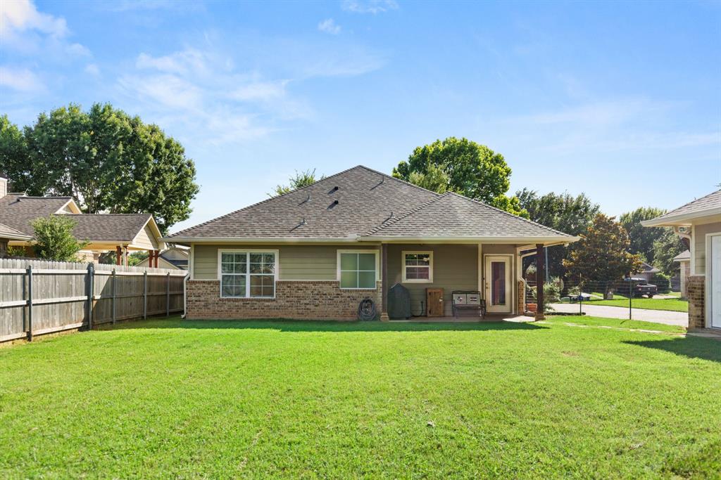 10609 Aquilla Trail Waco, TX 76708 - Photo 9 of 30 Expansive green lawn surrounds the rear of the property