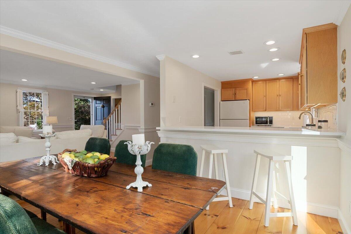 102 Gorham Road Harwich Port, MA 02646 - Photo 25 of 64 a living room with kitchen island furniture and wooden floor