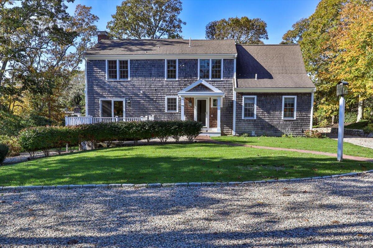 102 Gorham Road Harwich Port, MA 02646 - Photo 3 of 64 a front view of a house with a yard and garage