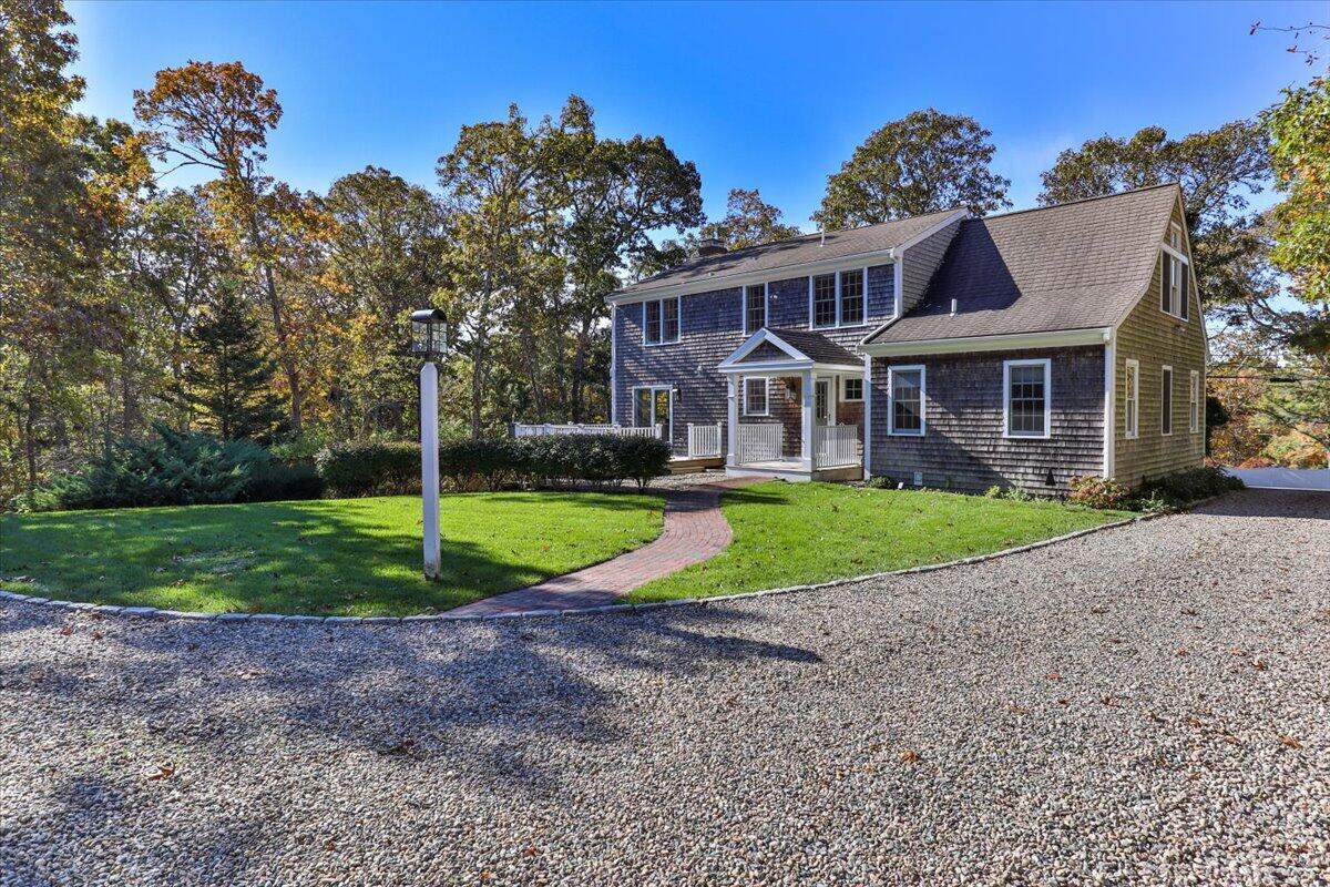 102 Gorham Road Harwich Port, MA 02646 - Photo 4 of 64 a view of a house with a yard and large tree