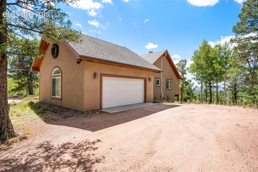 131 Paradiso Road Divide, CO 80814 - Photo 42 of 50 a front view of a house with a yard and garage