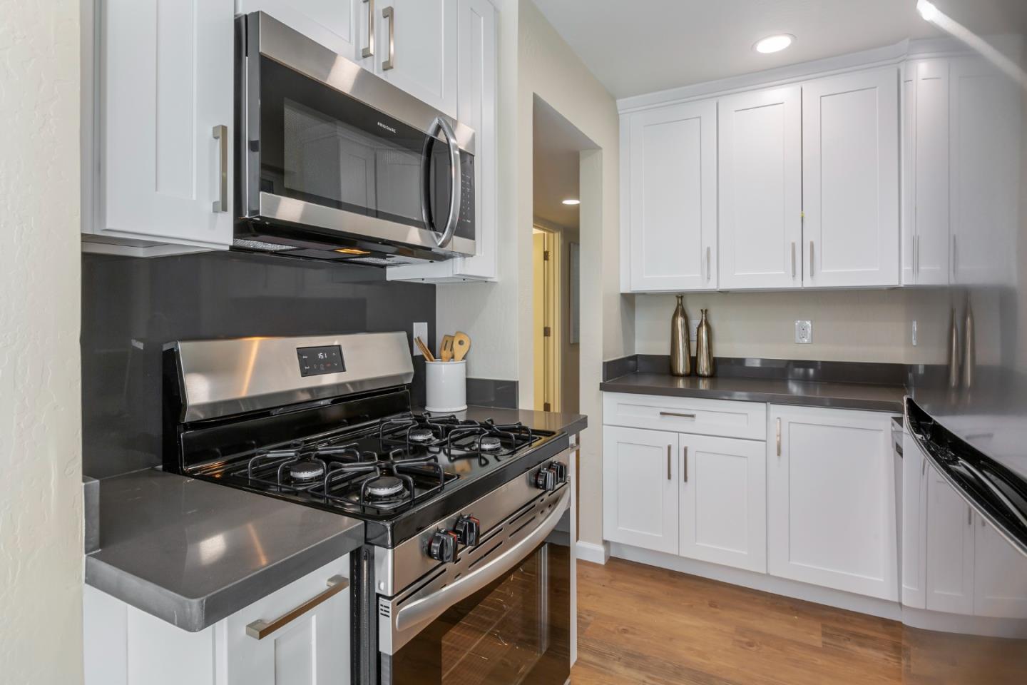 8 Cassandra Way Mountain View, CA 94043 - Photo 15 of 35 a kitchen with stainless steel appliances granite countertop a stove and a microwave