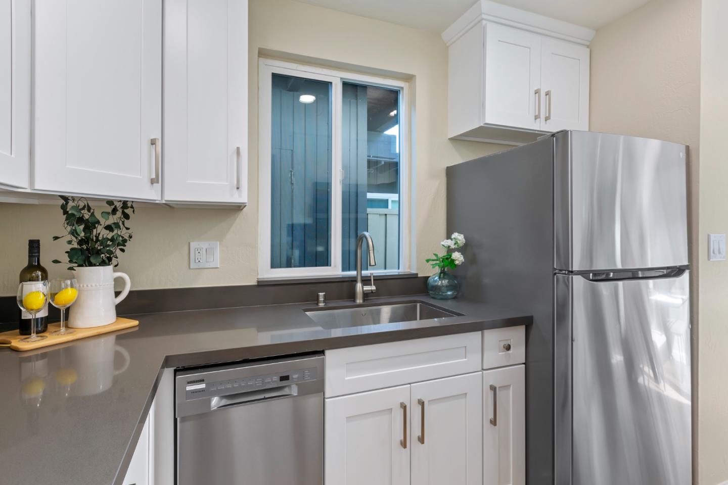 8 Cassandra Way Mountain View, CA 94043 - Photo 16 of 35 a kitchen with stainless steel appliances granite countertop a refrigerator white cabinets and a sink