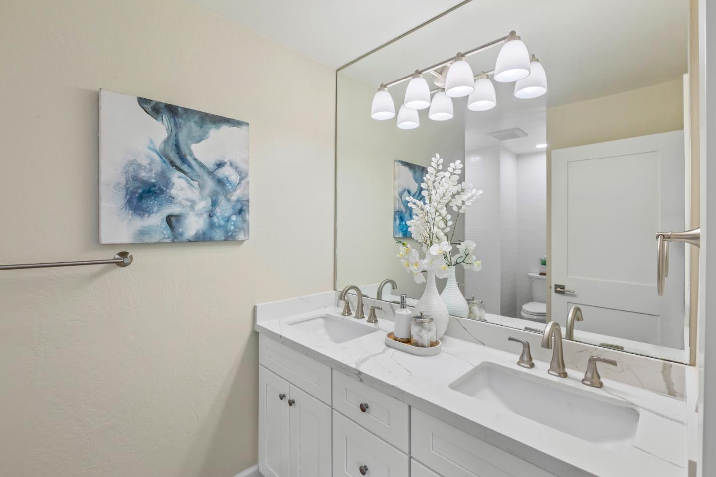 8 Cassandra Way Mountain View, CA 94043 - Photo 26 of 35 a bathroom with a double vanity sink and a mirror