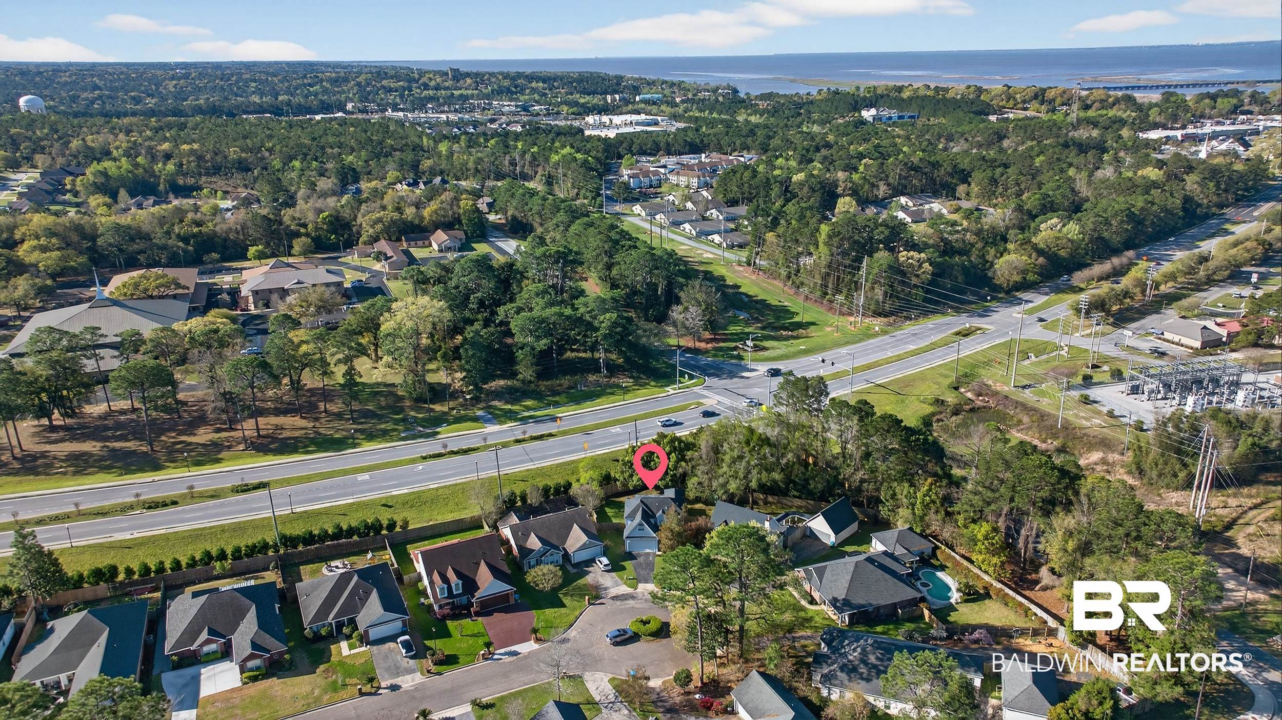 7050 Highpointe Place West Daphne, AL 36527 - Photo 65 of 66 Aerial overview of property's location with nearby suburban area and a nearby body of water