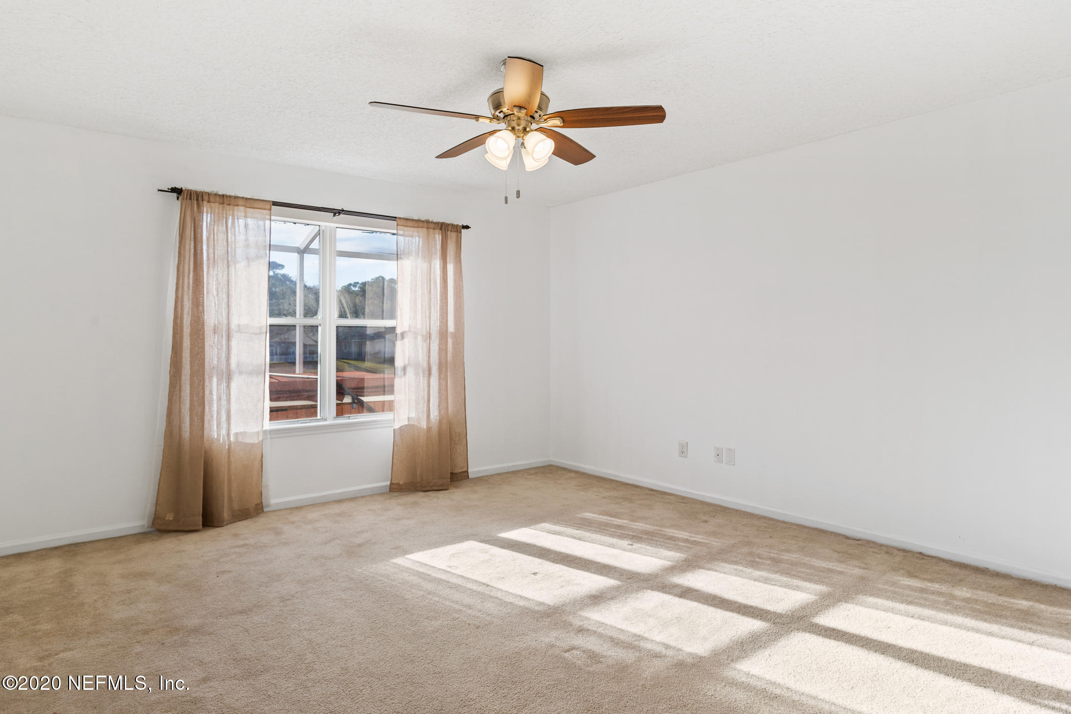 2514 Paris Mill Road Jacksonville, FL 32221 - Photo 16 of 29 an empty room with windows and fan