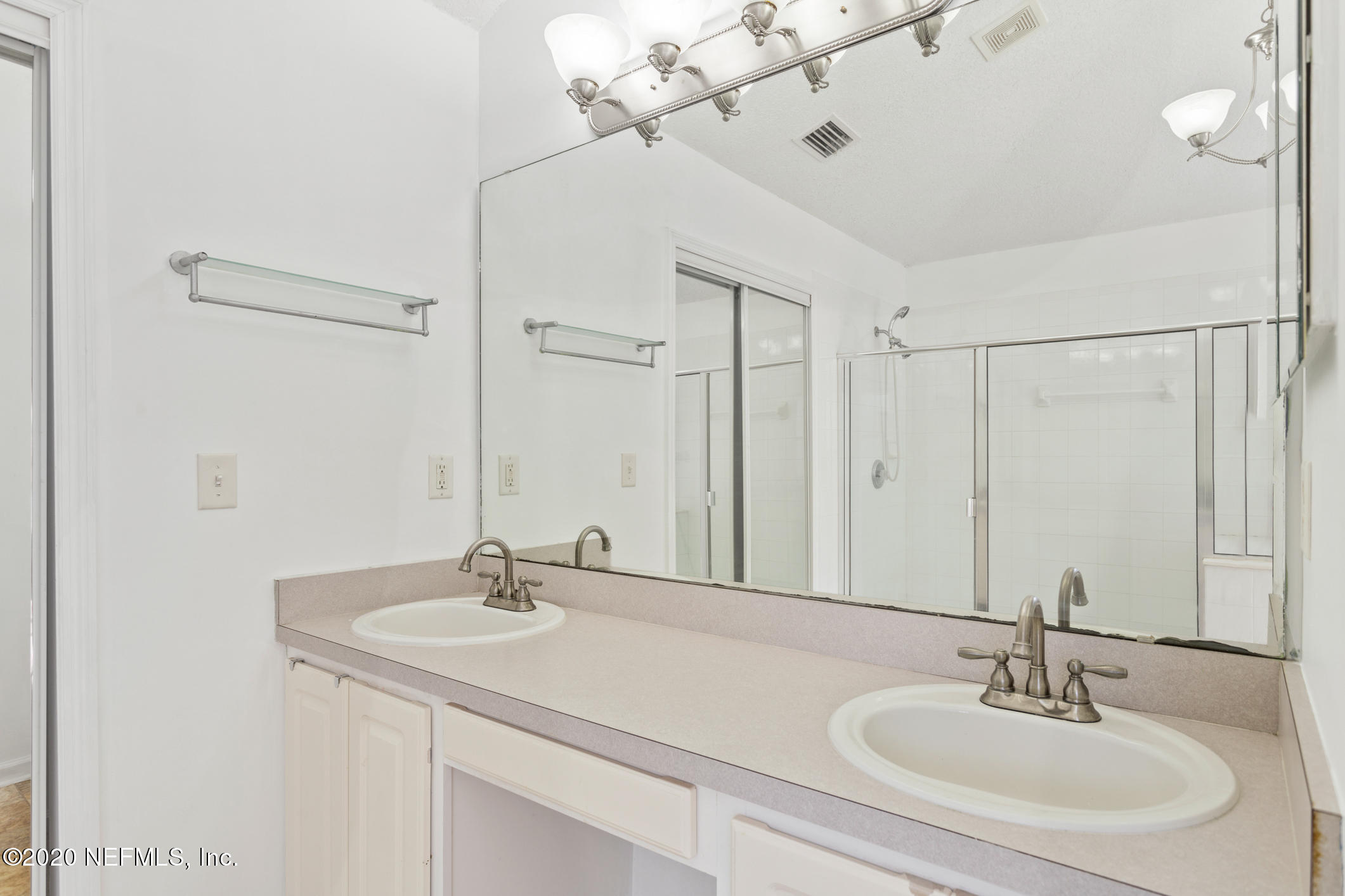 2514 Paris Mill Road Jacksonville, FL 32221 - Photo 18 of 29 a bathroom with a sink and a mirror