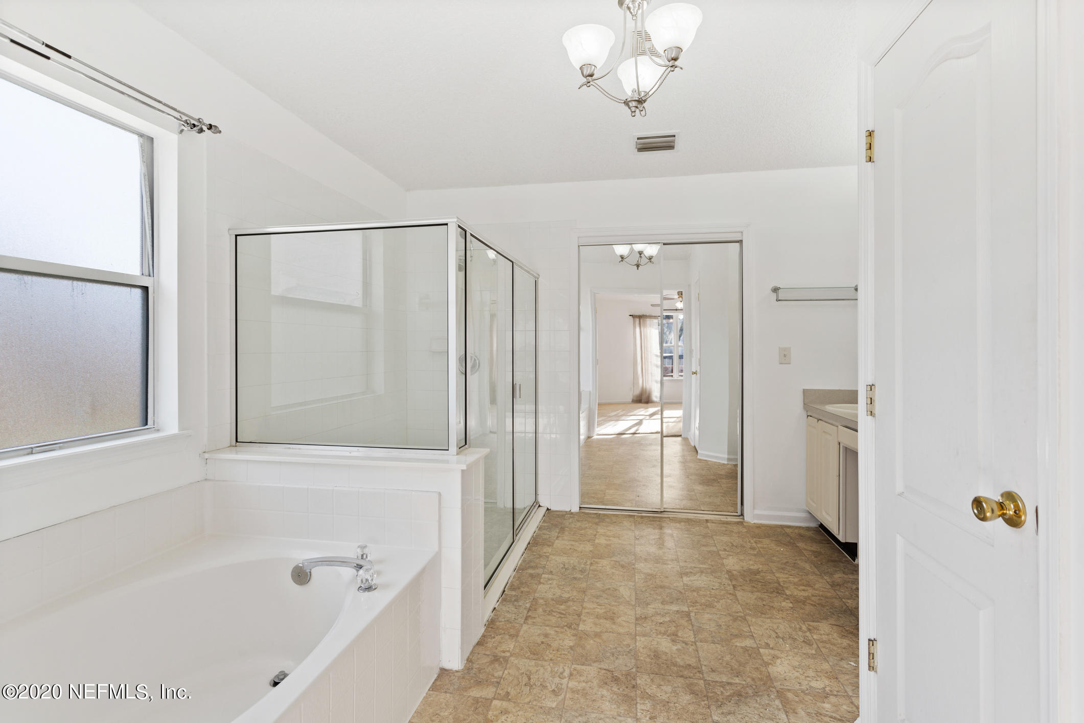 2514 Paris Mill Road Jacksonville, FL 32221 - Photo 19 of 29 a bathroom with a bathtub and a shower