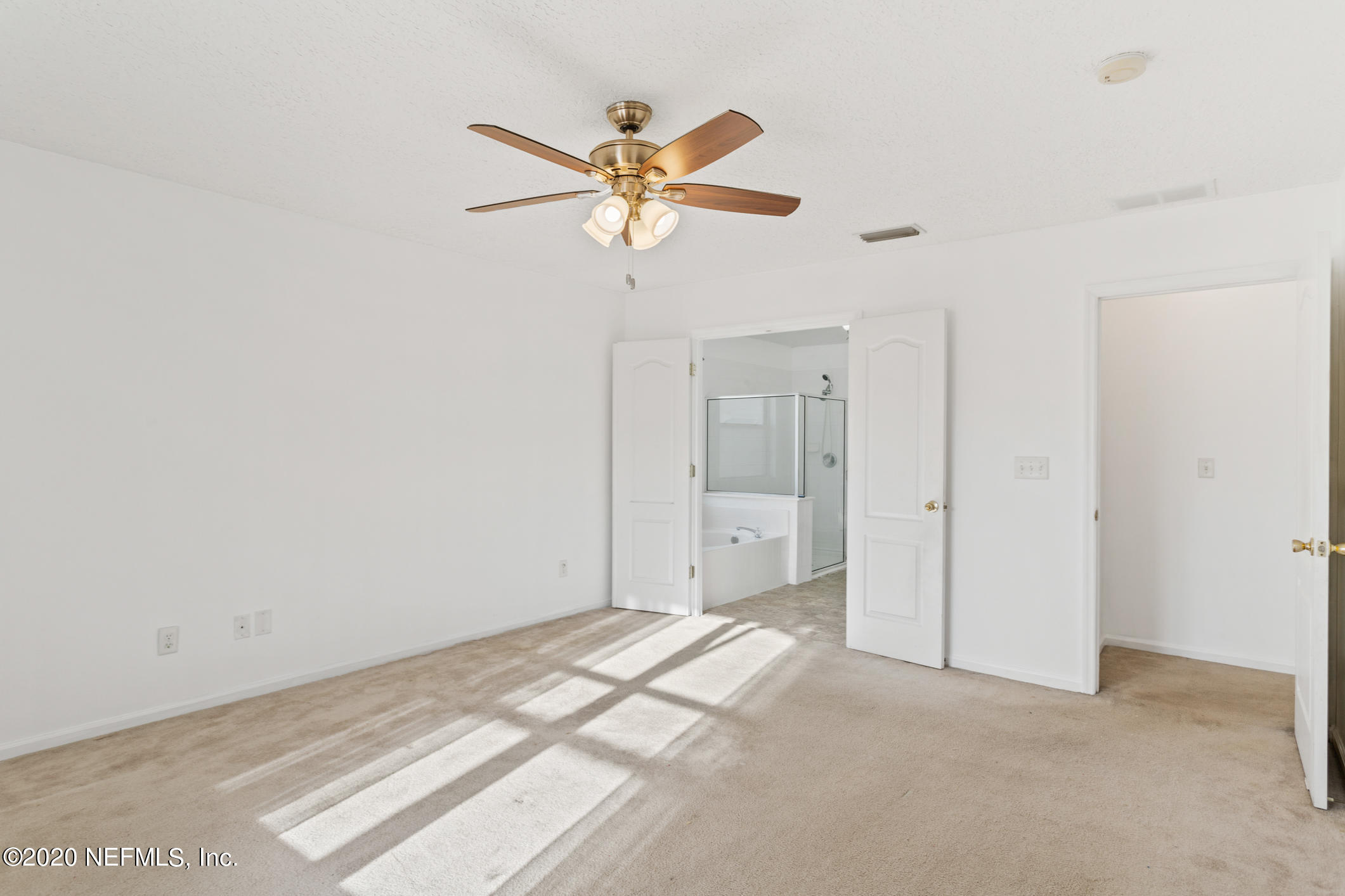 2514 Paris Mill Road Jacksonville, FL 32221 - Photo 20 of 29 a view of a livingroom with a chandelier fan and a window