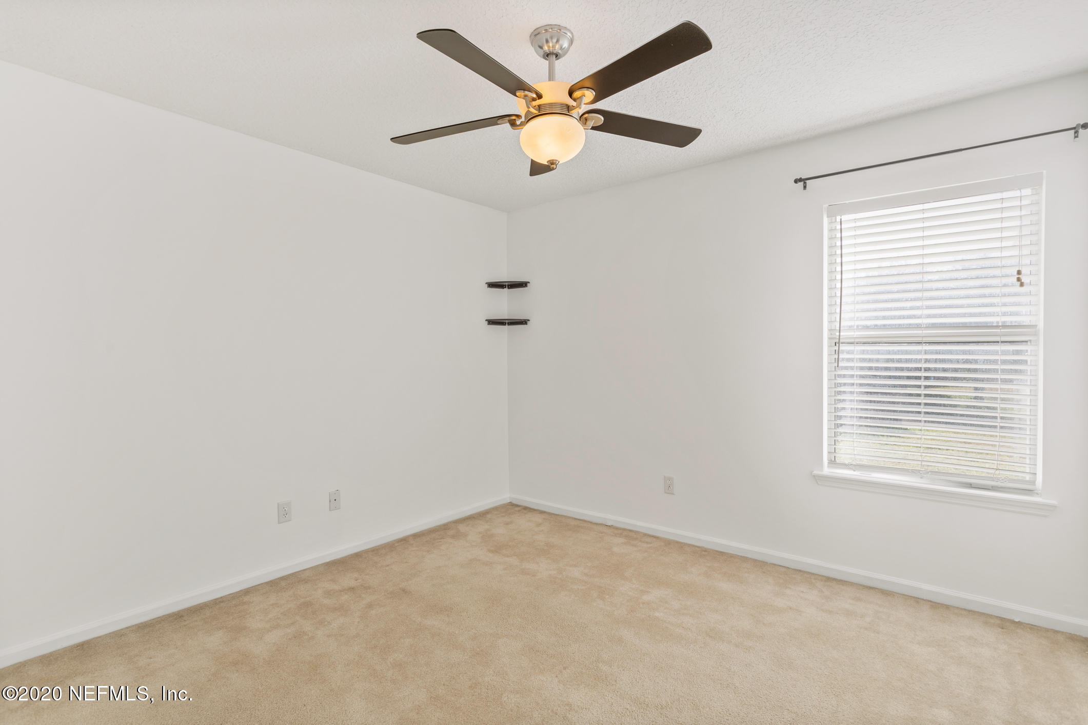 2514 Paris Mill Road Jacksonville, FL 32221 - Photo 23 of 29 an empty room with a window and a ceiling fan