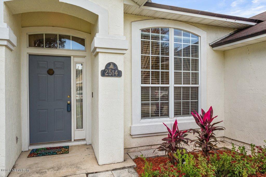 2514 Paris Mill Road Jacksonville, FL 32221 - Photo 3 of 29 a potted plant sitting in front of a door