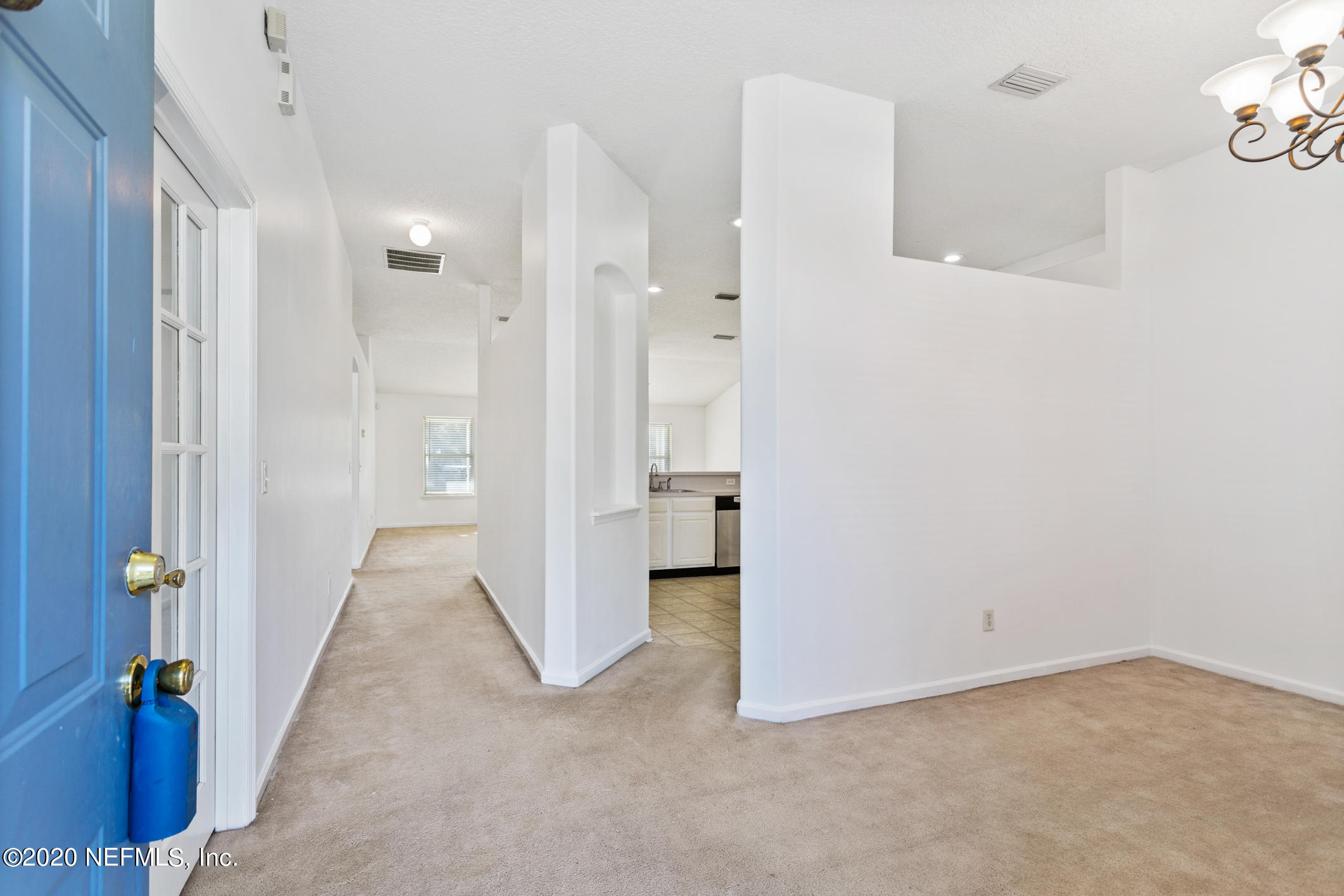 2514 Paris Mill Road Jacksonville, FL 32221 - Photo 4 of 29 a view of a hallway with wooden shelves