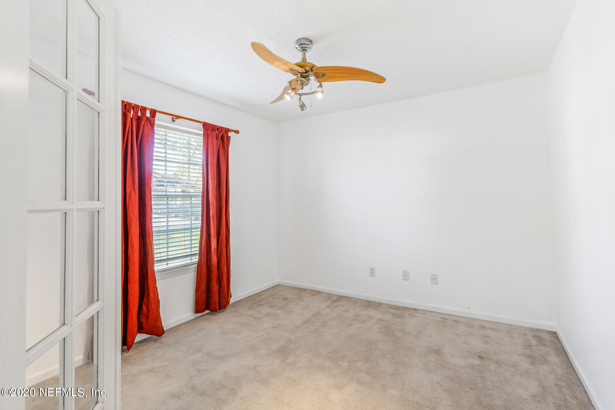 2514 Paris Mill Road Jacksonville, FL 32221 - Photo 7 of 29 an empty room with a ceiling fan and window