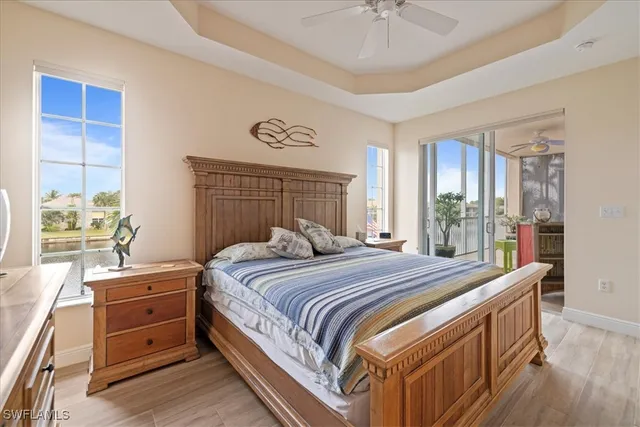 a bathroom with a granite countertop sink a mirror and shower