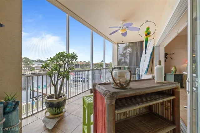 a bedroom with a bed window and a table