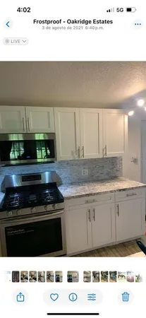 a kitchen with a stove and a microwave