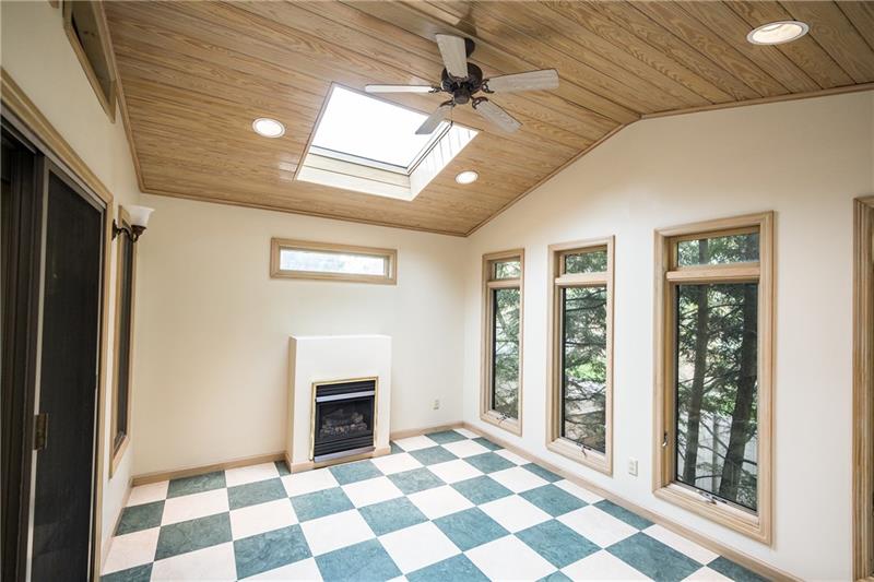 2931 Fernwald Road Pittsburgh, PA 15217 - Photo 13 of 22 Vaulted ceilings, skylights, and a gas fireplace are features of this space.
