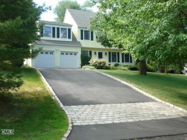 54 Fieldstone Road Stamford, CT 06902 - Photo 1 of 1 a front view of a house with a garden